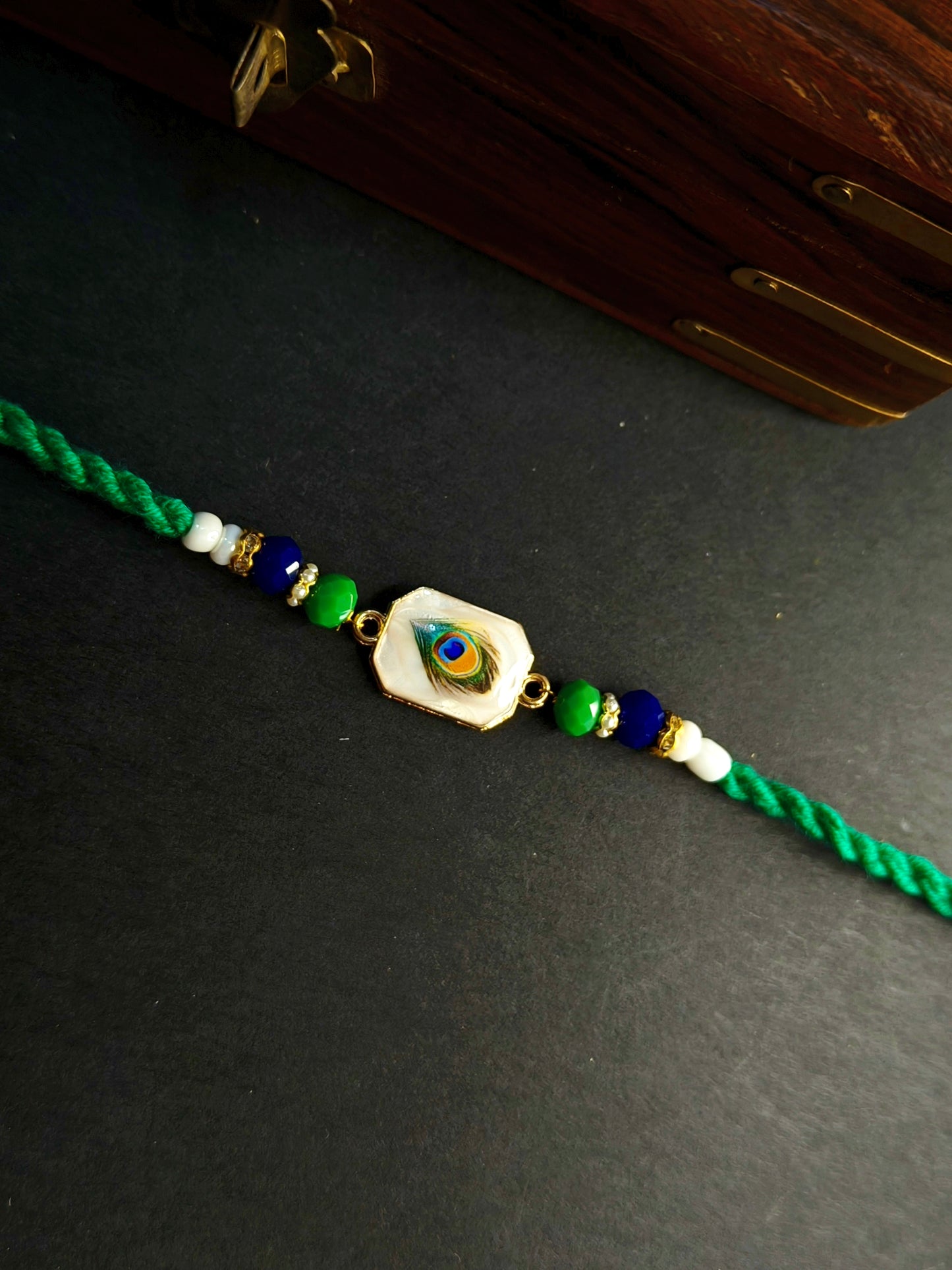 FEATHER RED TWISTED BHAI RAKHI