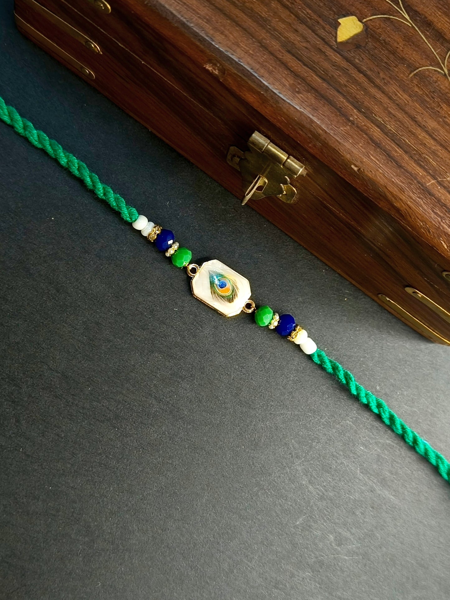 FEATHER RED TWISTED BHAI RAKHI