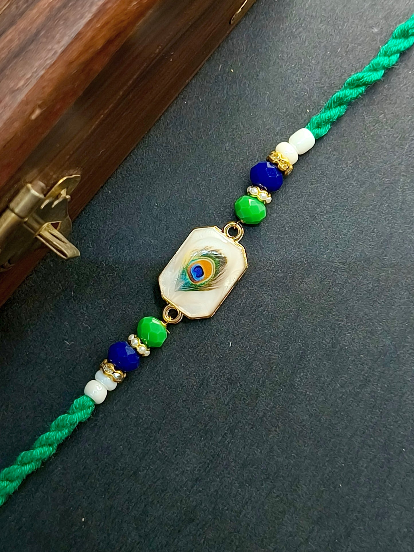 FEATHER RED TWISTED BHAI RAKHI