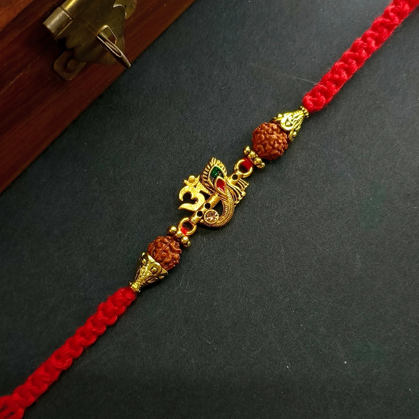 OM FLUTE FEATHER BHAI RAKHI